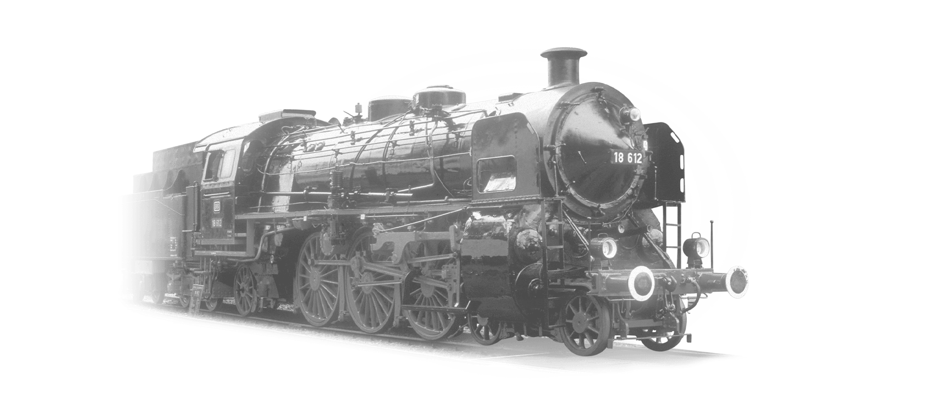 The locomotive 18-612 is coming towards the camera in black and white