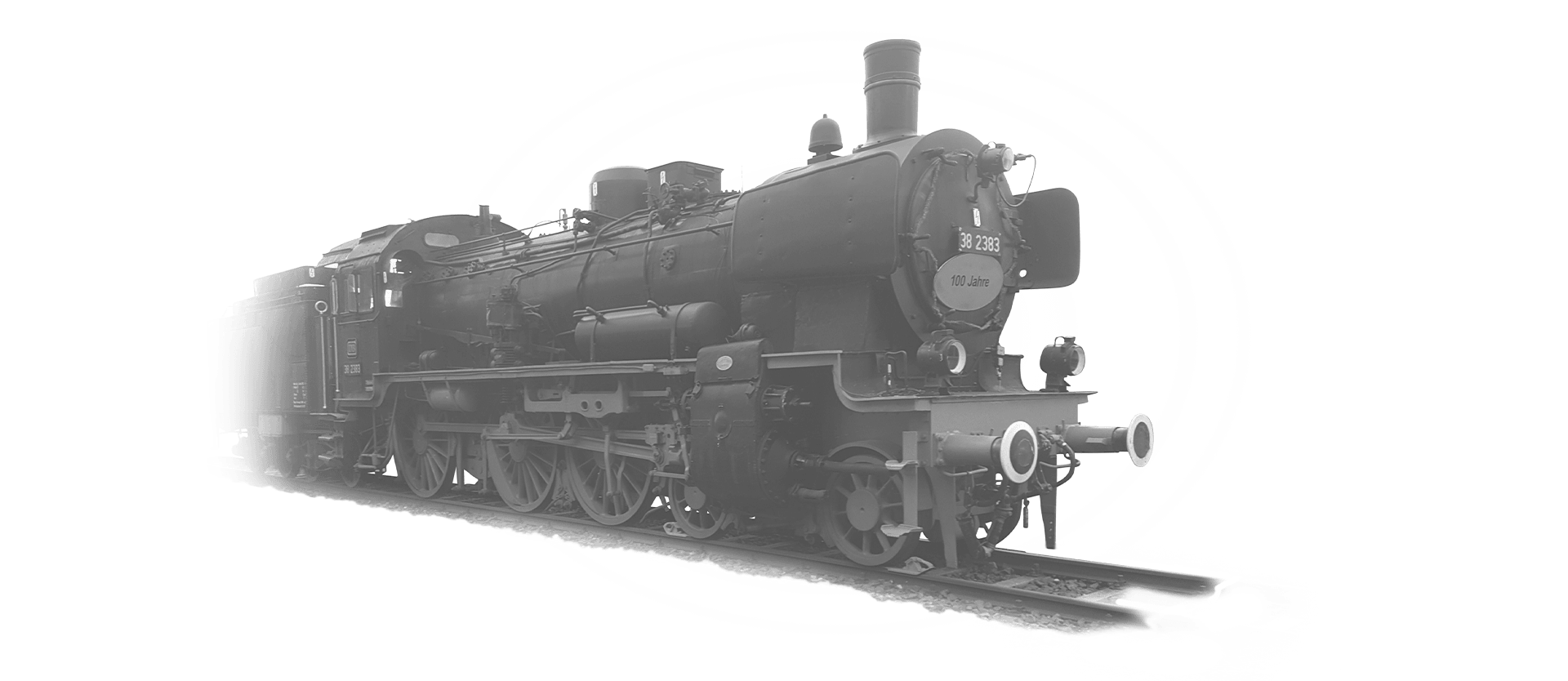 The locomotive 38-2383 is coming towards the camera in black and white