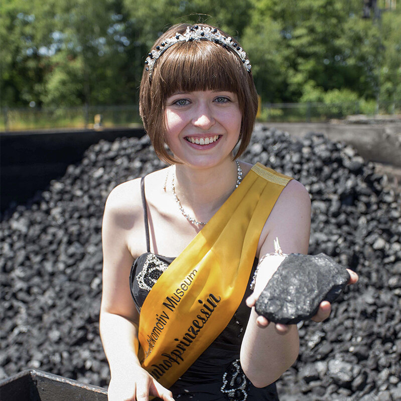 The princess of the coal yard Ramona I. is holding a lump of coal