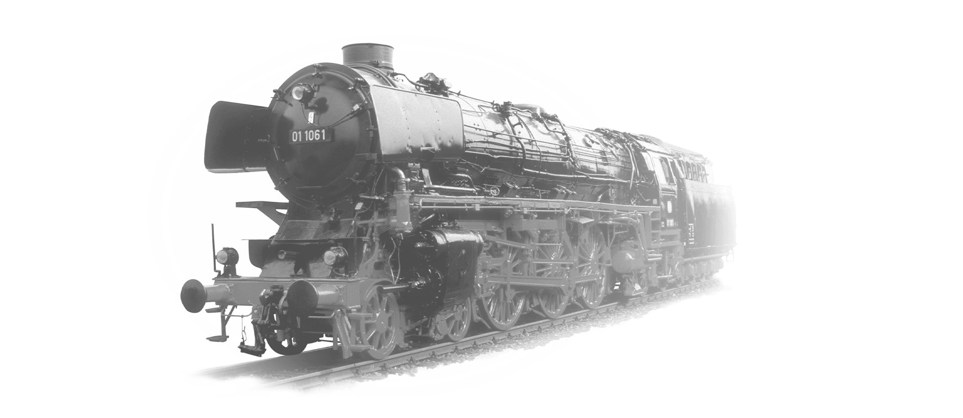 The locomotive 01-1061 is coming towards the camera in black and white