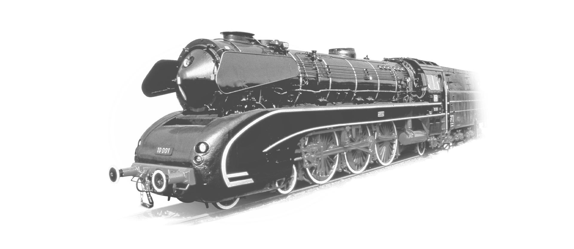 The locomotive 10-001 is coming towards the camera in black and white