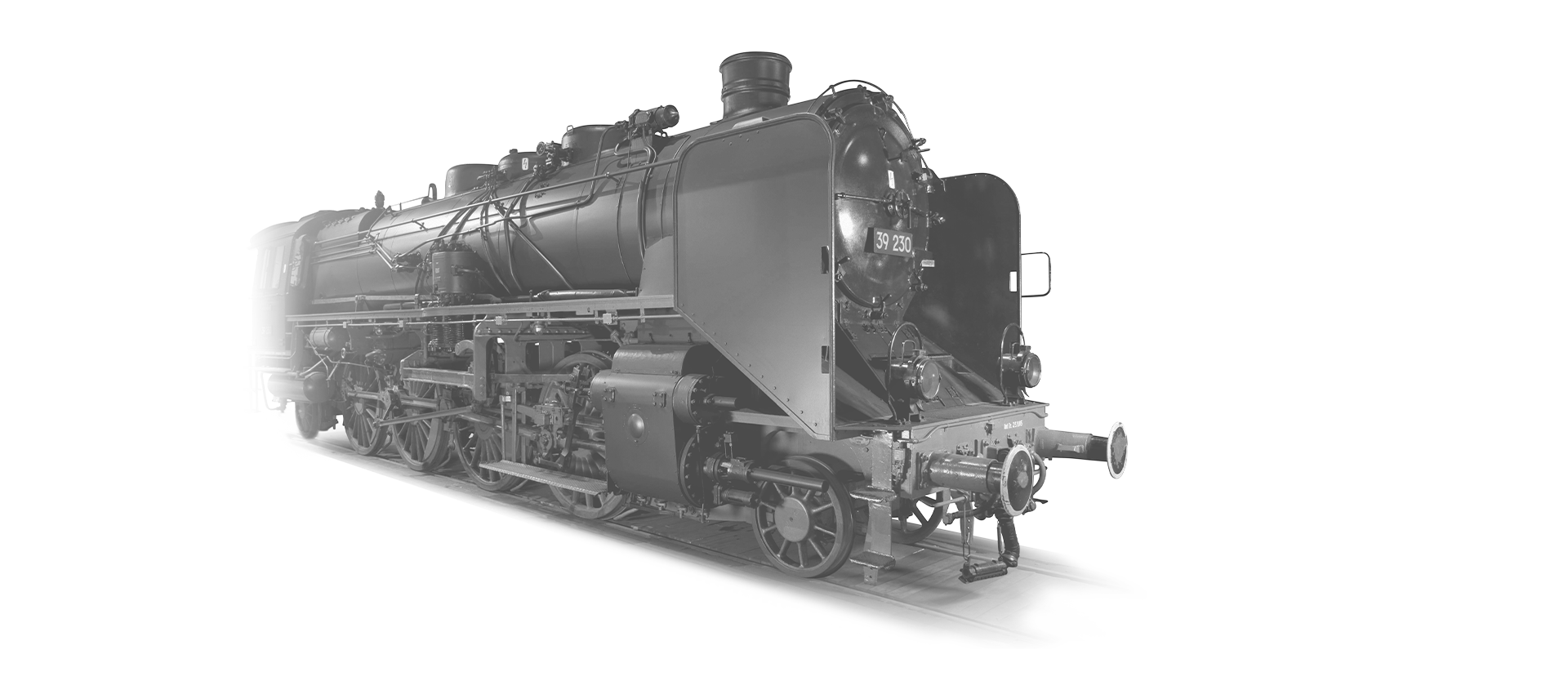 The locomotive 39-230 is coming towards the camera in black and white