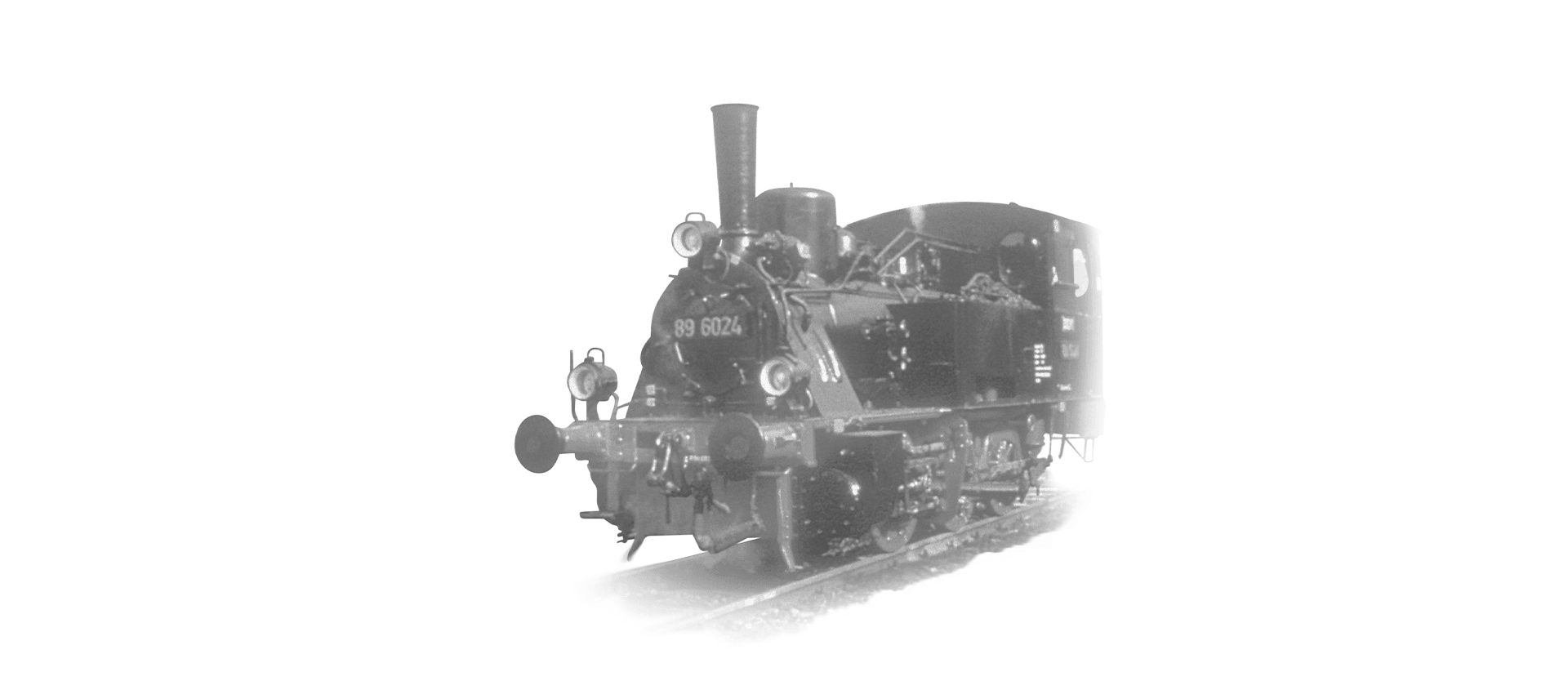 The locomotive 89-6024 is coming towards the camera in black and white
