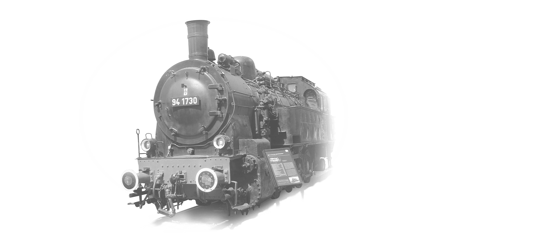 The locomotive 94-1730 is coming towards the camera in black and white