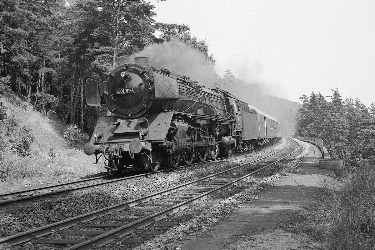 Steam locomotive 01-111 at work in black and white